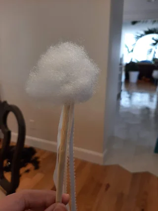 Stuffing glued to the end of the stick